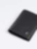 A premium black leather wallet with neat stitching and a subtle silver logo, showcasing a sleek handcrafted design.