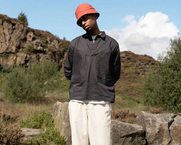Man wearing organic cotton smock top from sustainable menswear brand wawwa