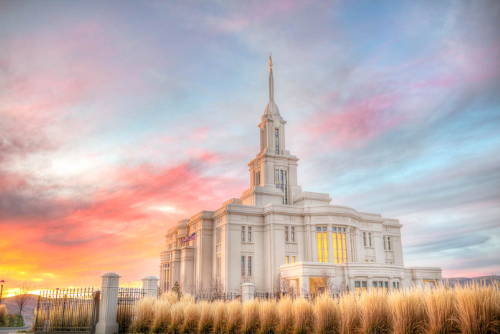 A pastel sky above the Payson Utah Temple and an autumn field. 