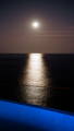 Moonlit coastal view over ocean from Havit outdoor lighting project