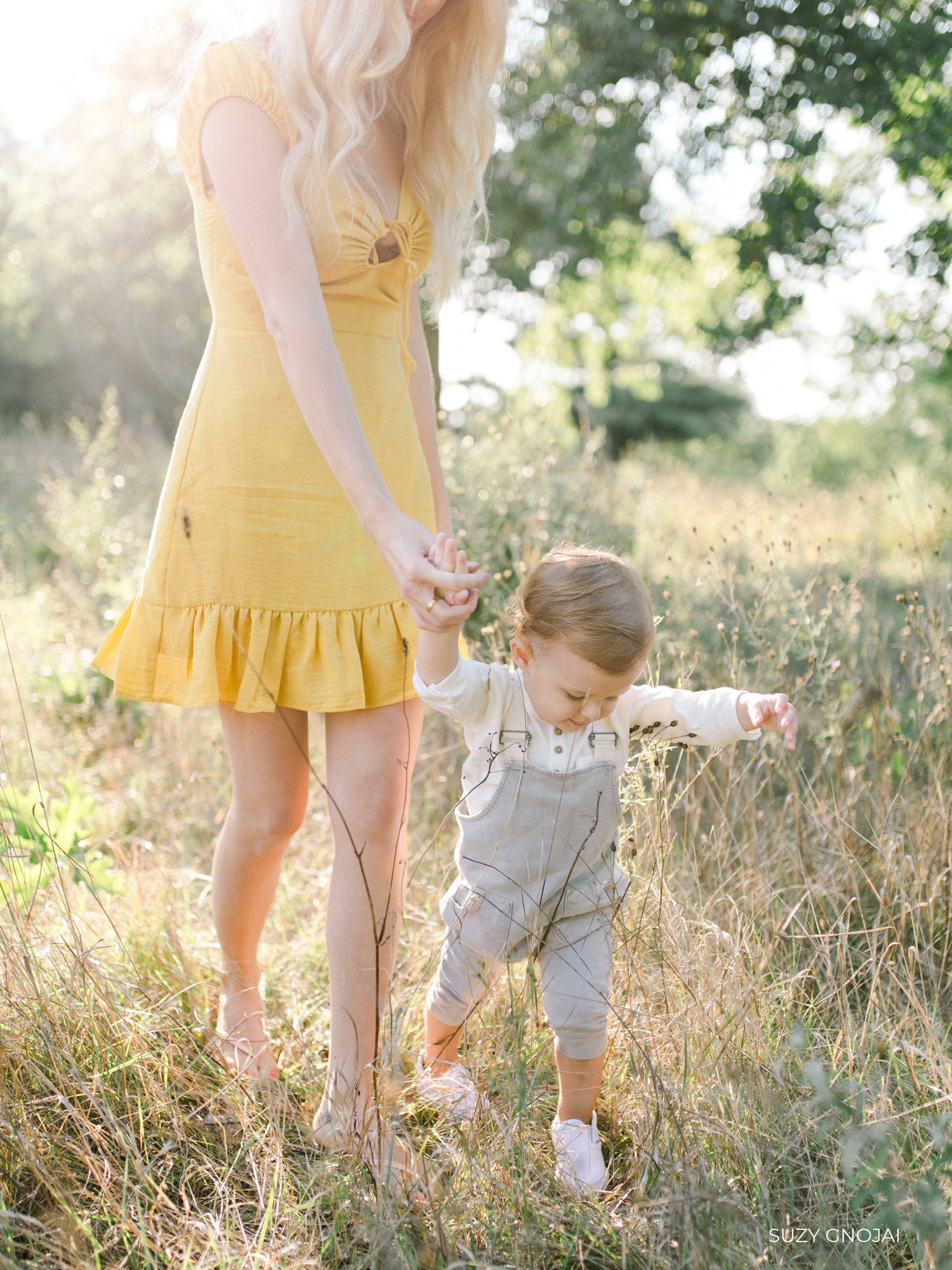 Girl in Yellow Dress Holding Toddler's Hand Edited with REFINED I Presets
