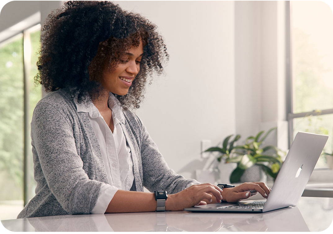 Woman wearing TouchPoints at computer