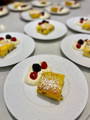 crepes flambeing in a pan with berries