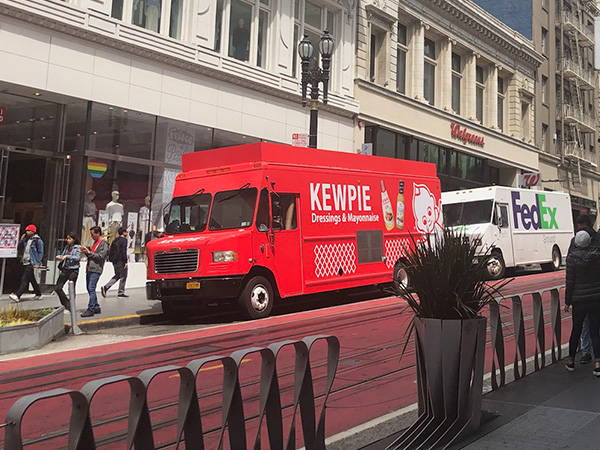 Kewpie truck parked next to FedEx Truck