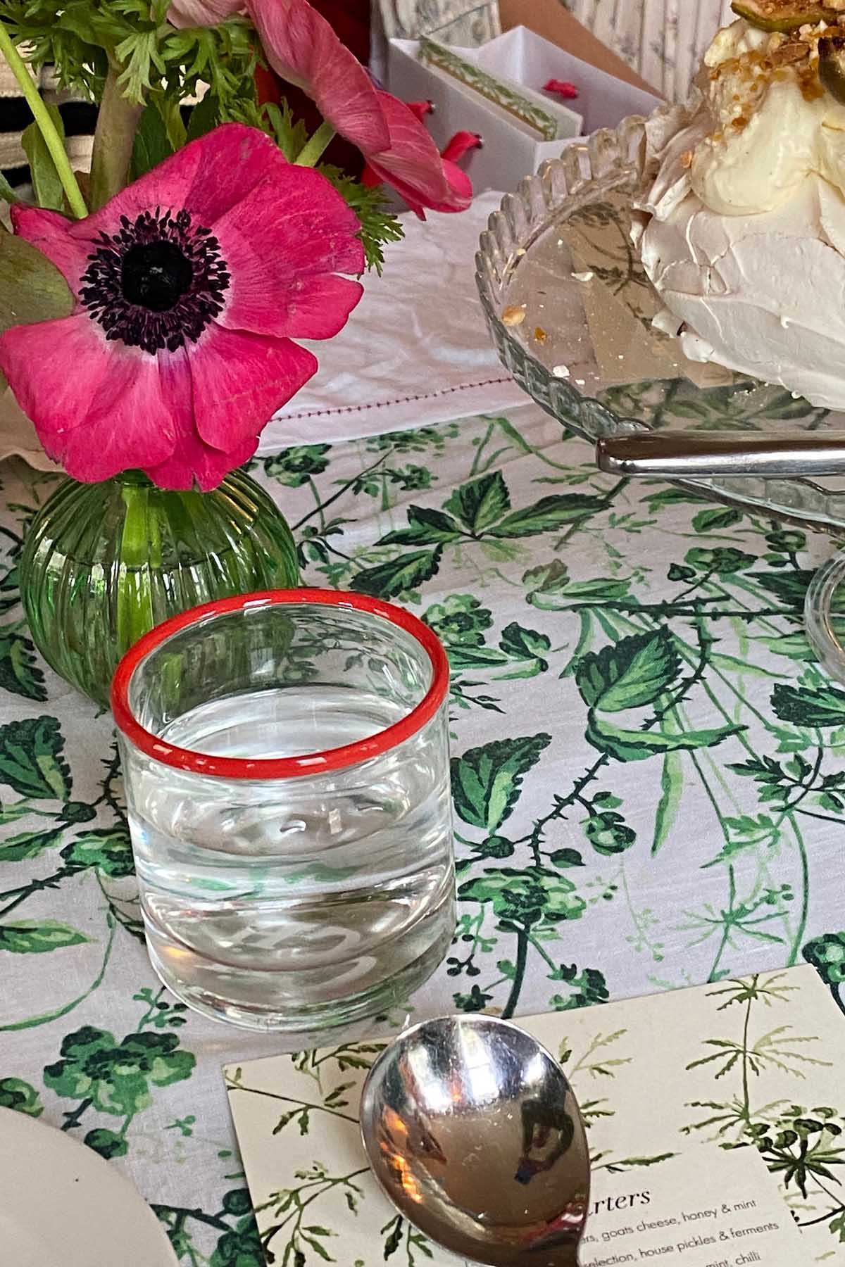 Close up of a spring table set with a linen tablecloth by YOLKE