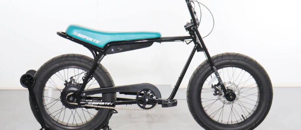 A black and green Super73 Z1 electric mini moto
