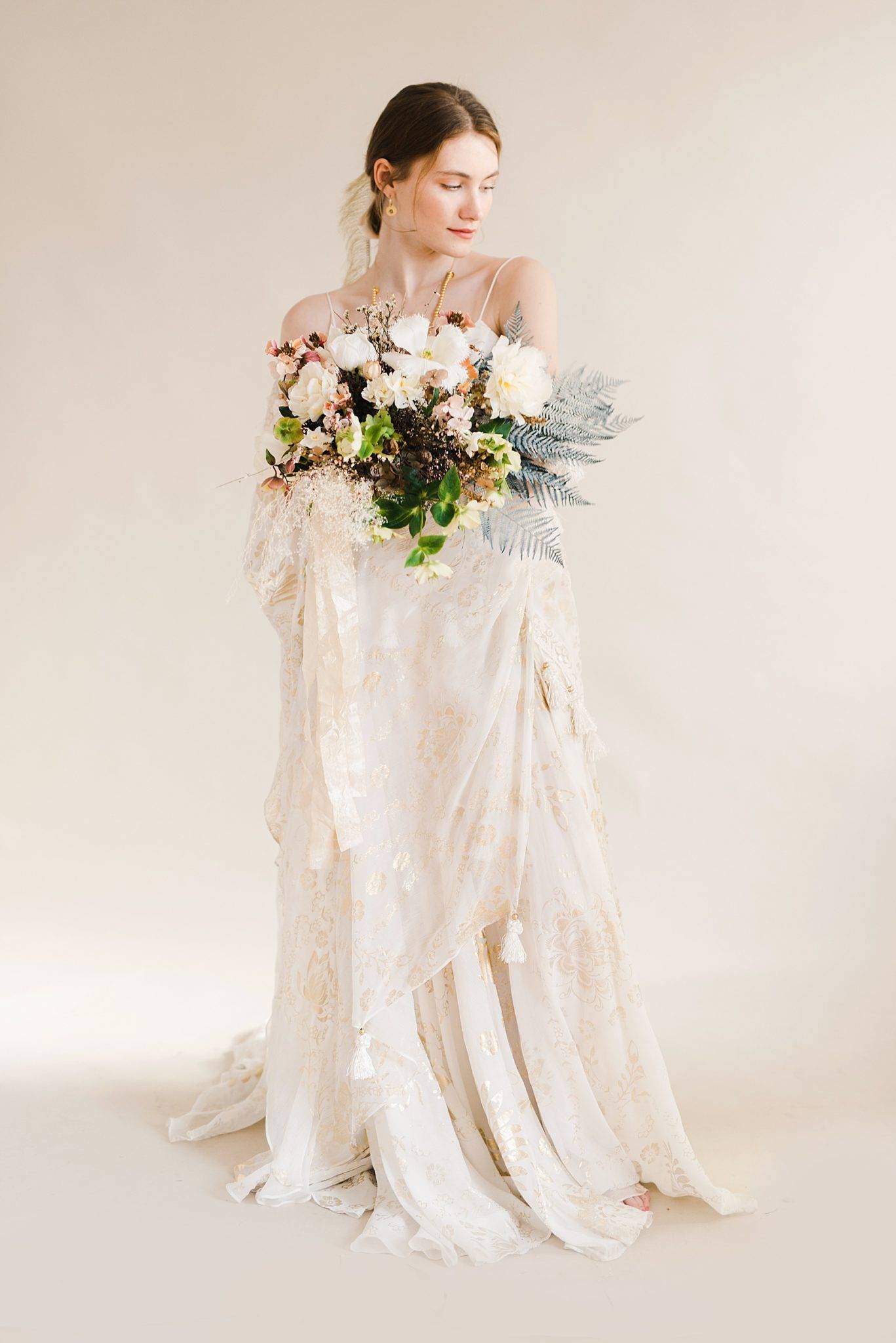 Luxury Wedding Editorial: Bride Facing to the Side Holding Bouquet