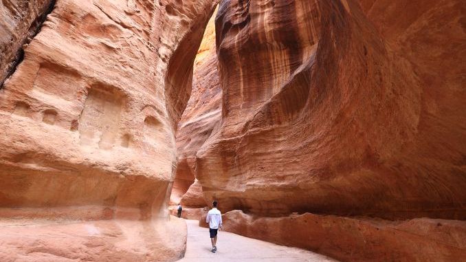 The Siq, the narrow slot-canyon that serves as the entrance passage to the hidden city of Petra, Jordan
