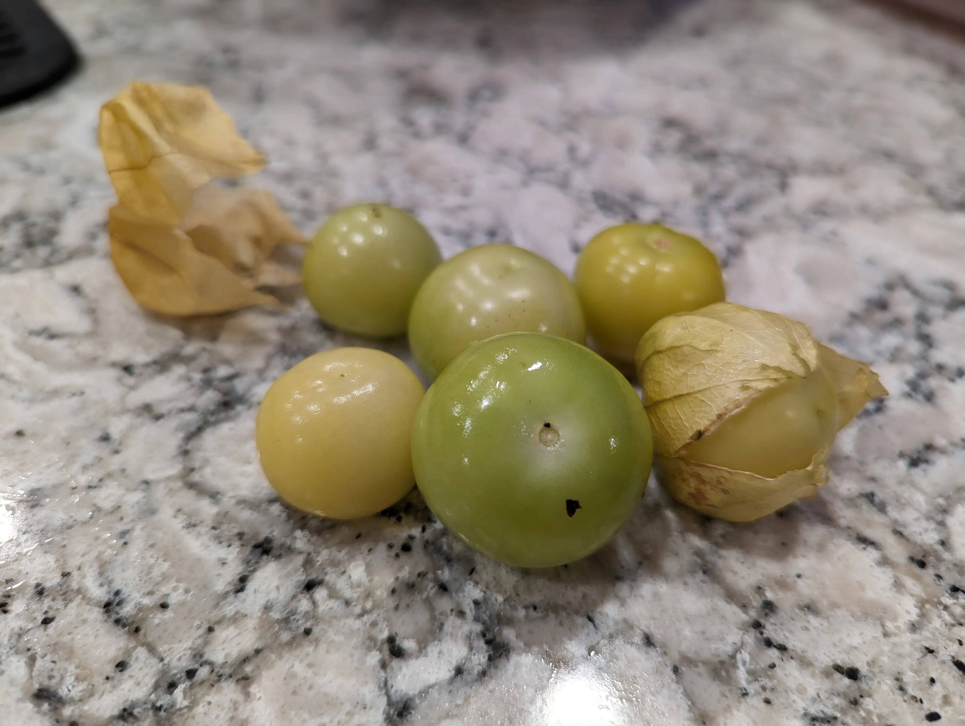 First, husk your tomatillos and wash off the stickiness.