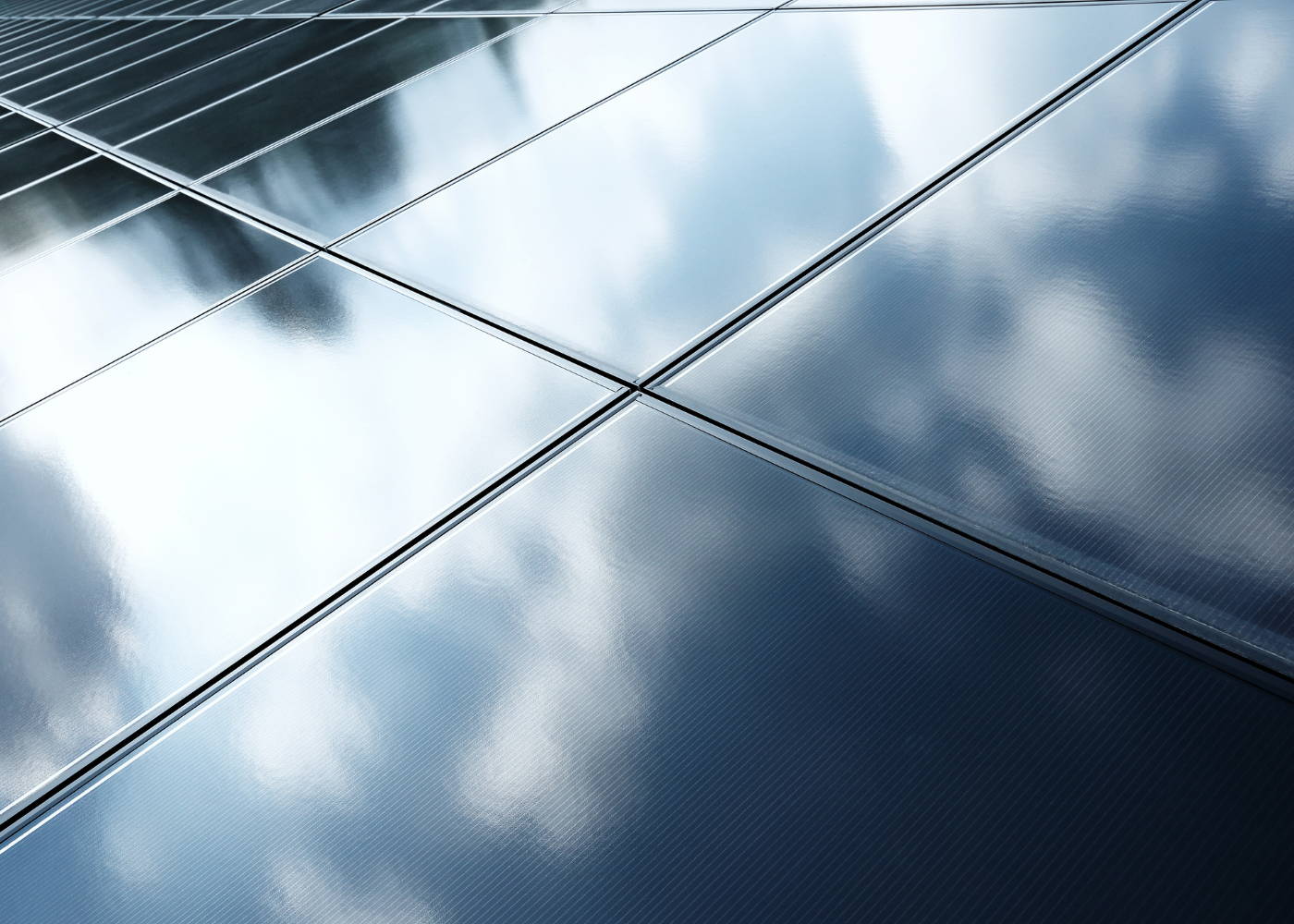 Solar panels reflecting clouds.