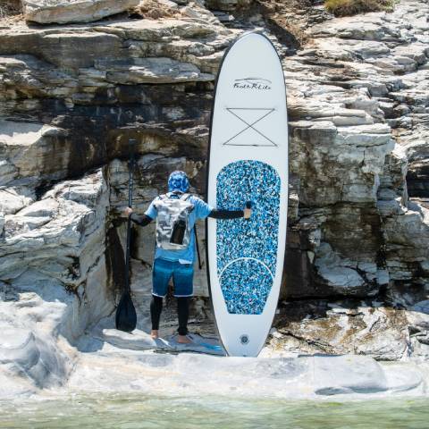 Customer lift his lightweigh inflatable paddle board