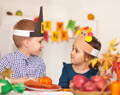Siblings doing pretend play together during screen-free toddler activity at home.