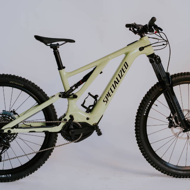 A tan Specialized Turbo levo electric mountain bike