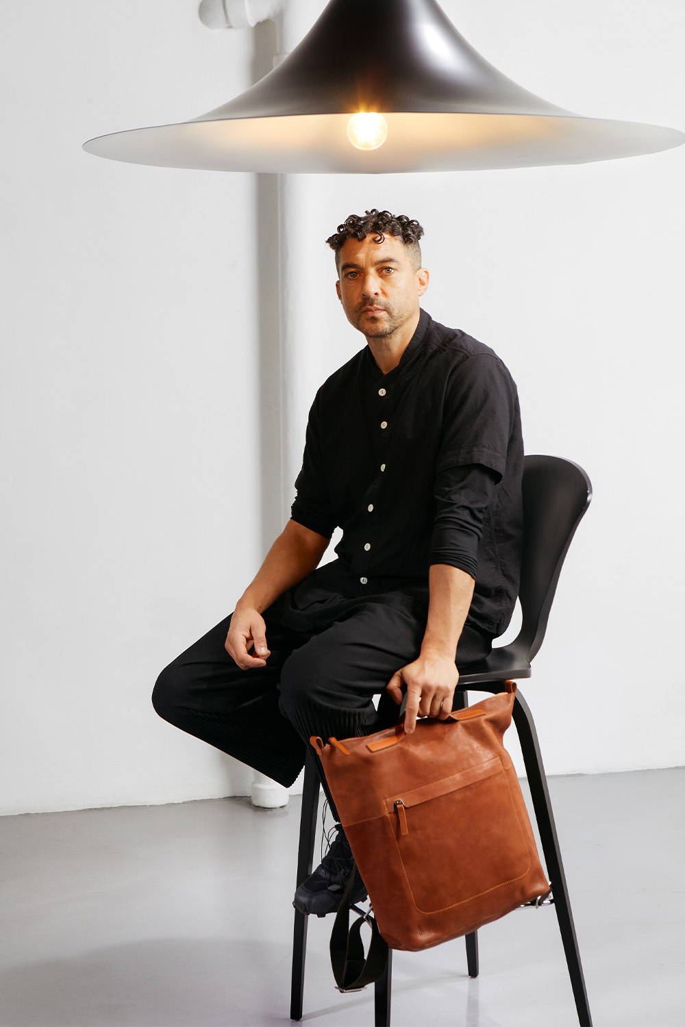 Marcus james with Ally capellino Lloyd Calvert Leather hoy backpack