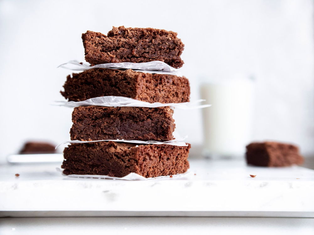 A four tier stack of fudgy brownies