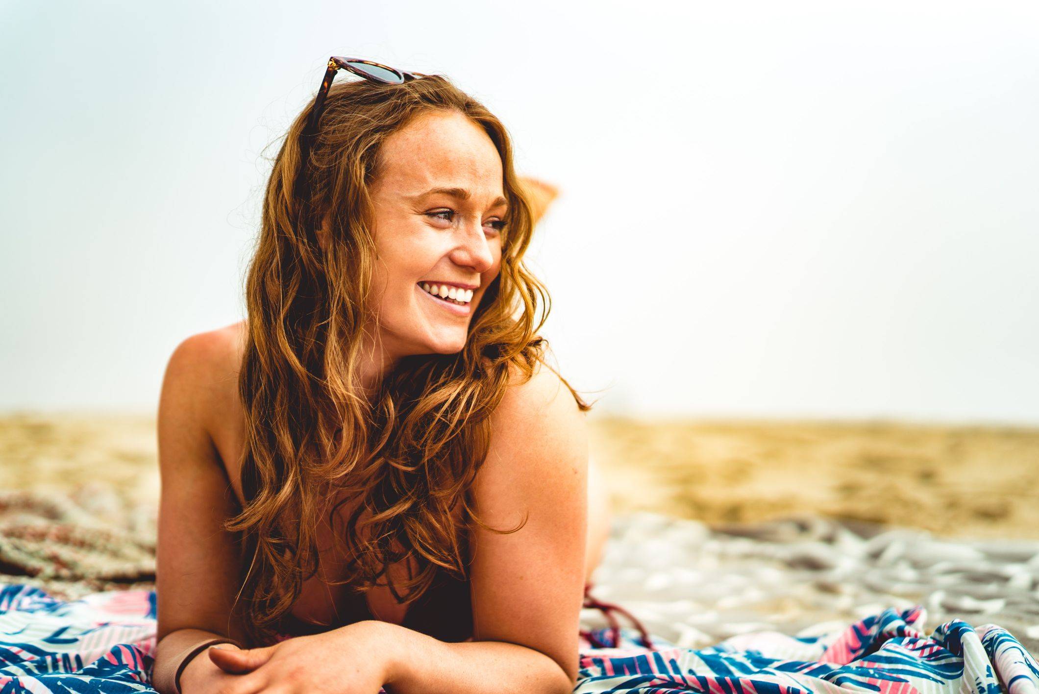 Image of a happy woman with a wavy hair