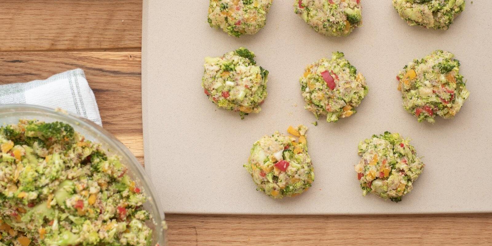 Bowl of veggie nugget mixture alongside 8 shaped nuggets