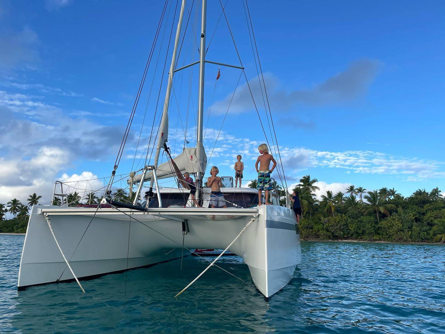 On board a sailboat or yacht in the pacific ocean anchored near a remote island