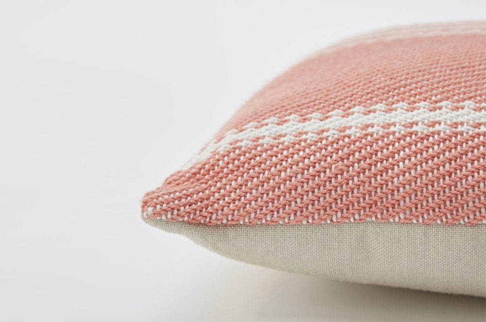 Close up of the Oxford Stripe Coral Cushion