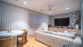 Balanced living room lighting with recessed downlights and ambient glow enhancing comfort and layout