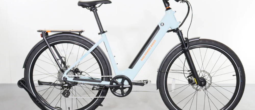 a light blue Rad Power Bikes RadKick electric city bike