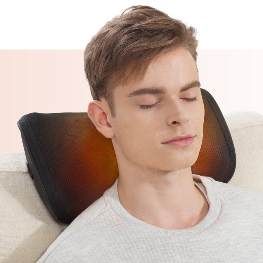 A man relaxing at home with eyes closed while using the OSIM uCozy 3D Neck and Shoulder massager