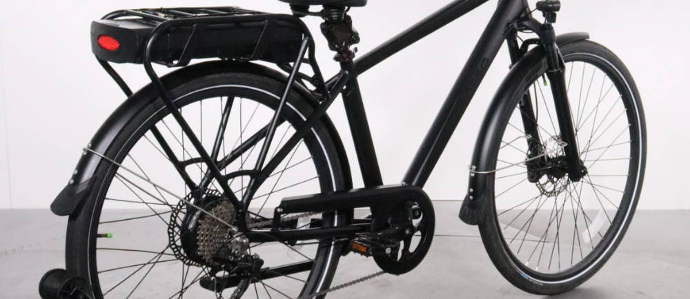 A rear, side view of the Pedego City Commuter Platinum Edition electric city bike