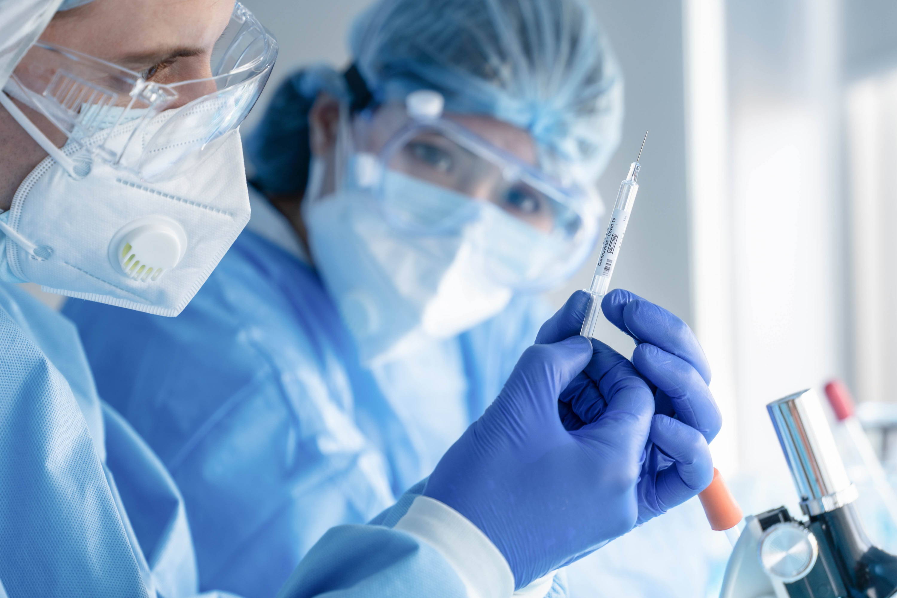 Doctors holding vaccine