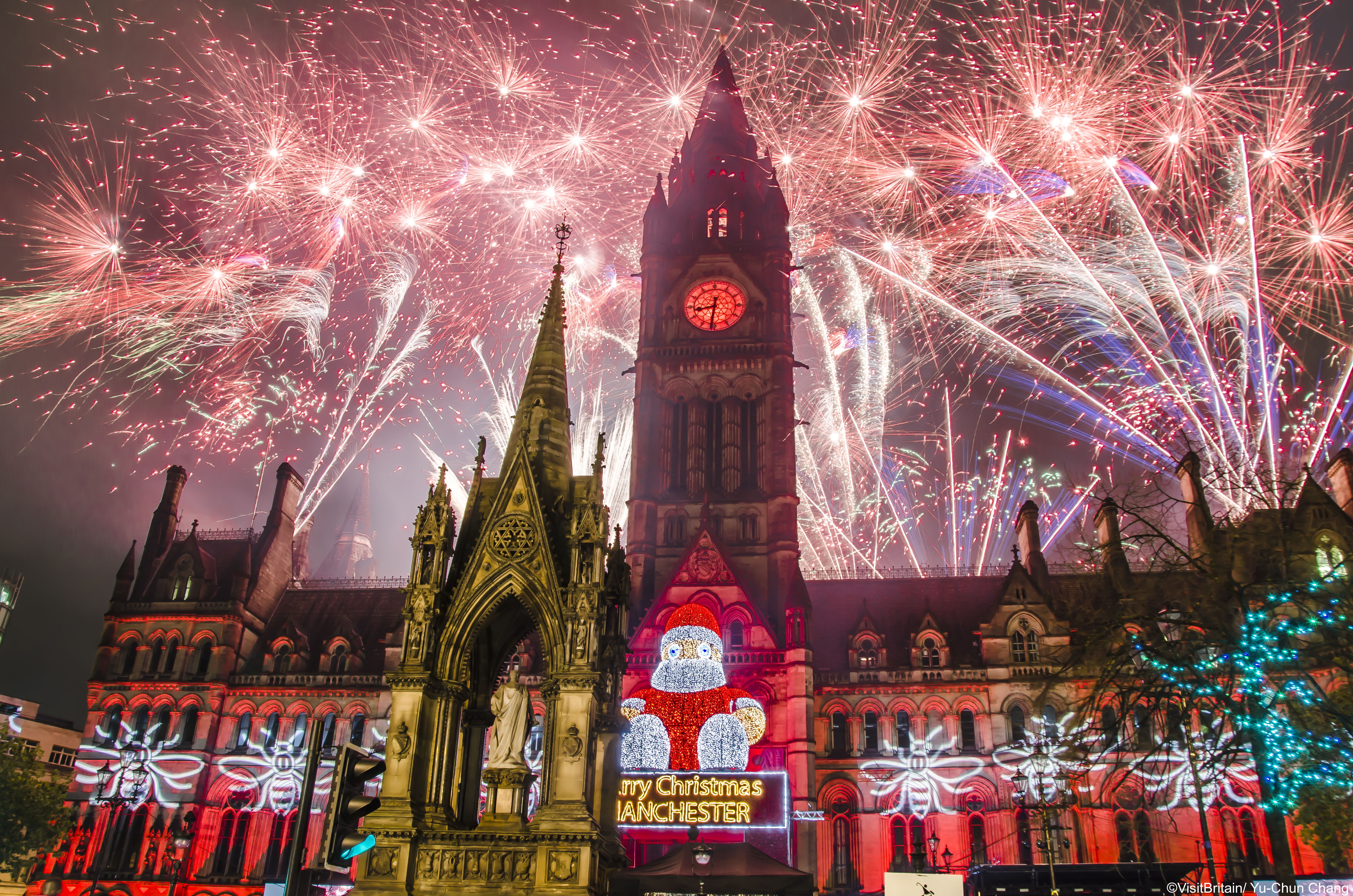 Firework display behind Manchester Town Hall 