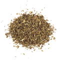 A small pile of greenish yellow dried mint leaves