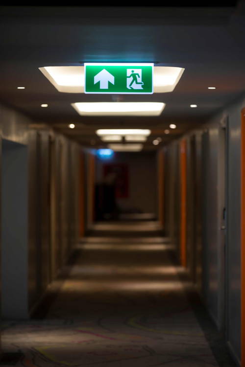 LED strip exit light in hospital corridor