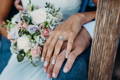 Bride and groom holding hands - discover the Reis-Nichols Diamond Difference