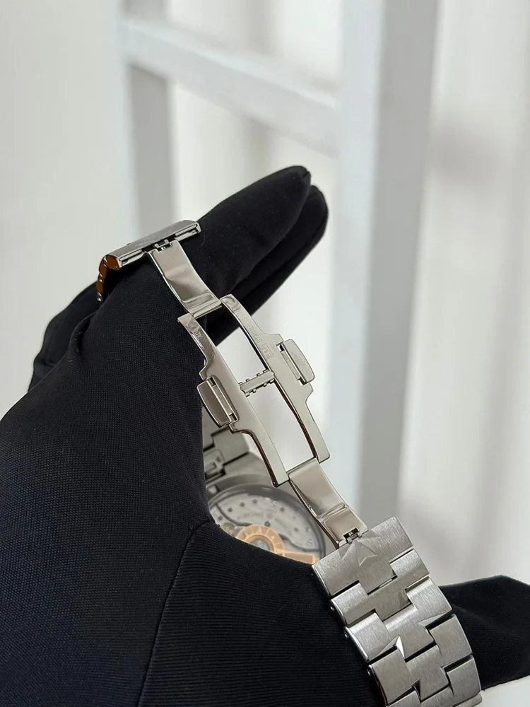 Leather strap included