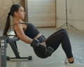 woman doing hip thrusters exercise with hyperbell bar