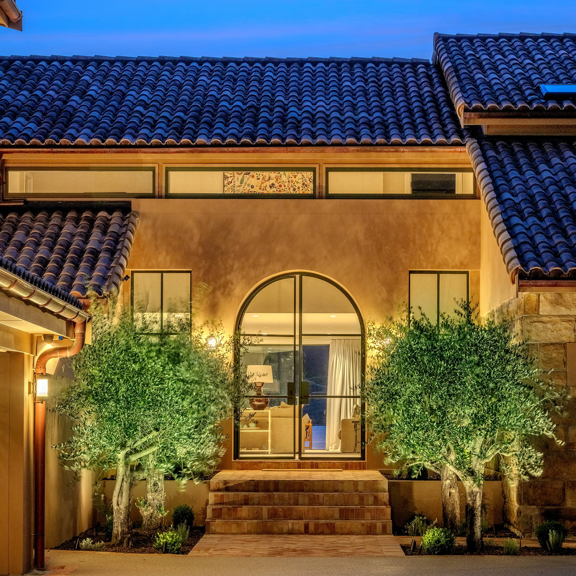 Havit Lighting - Outdoor Lighting by Havit  - Entryway illuminated by Garden Spike Lighting, uplighting on trees at the front entrance of the house
