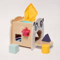 Montessori Baby Tissue Box featuring three tissues, four shape blocks, and a wooden box with panda illustration on the front.