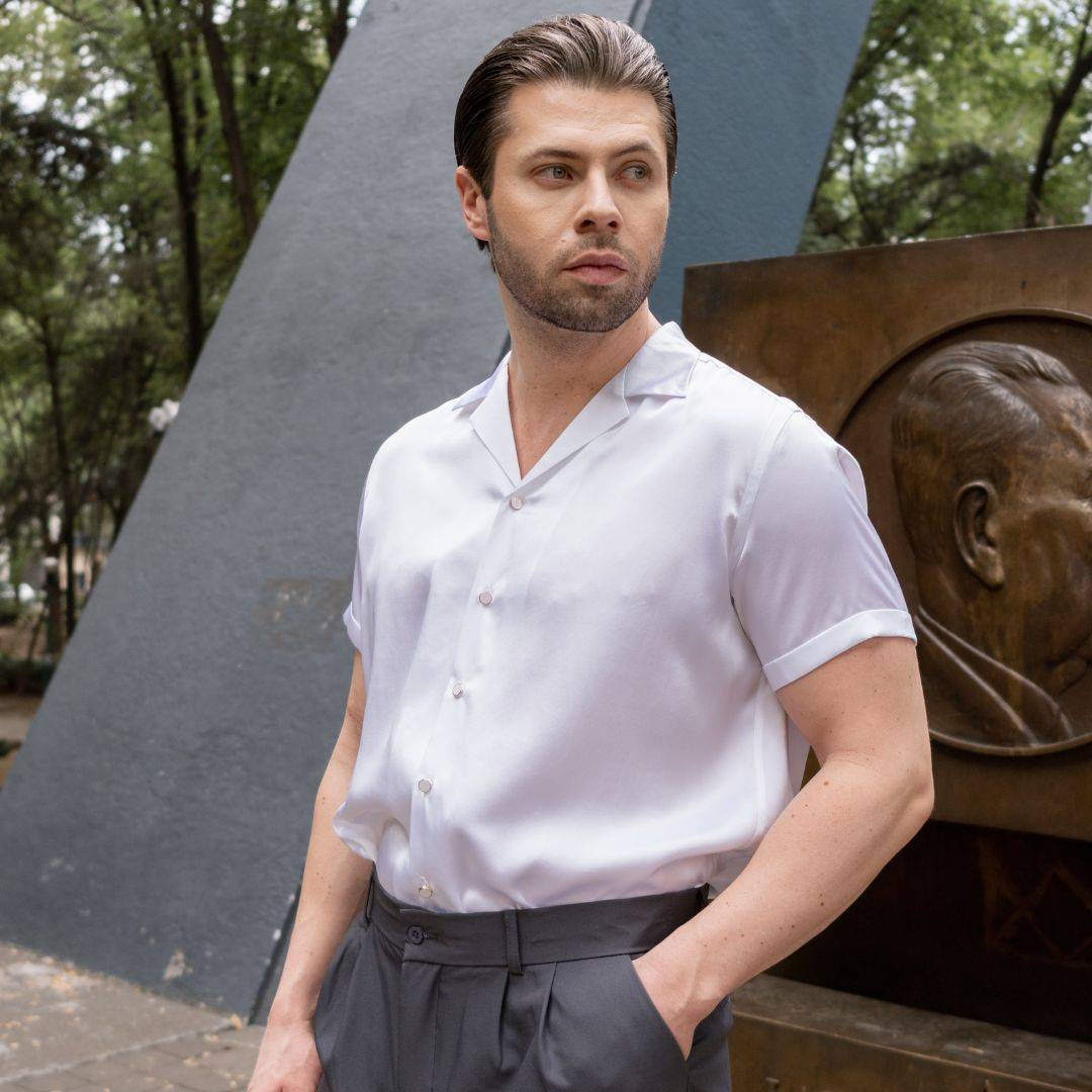 model standing in the park wearing a short sleeve white silk shirt from 1000 kingdoms