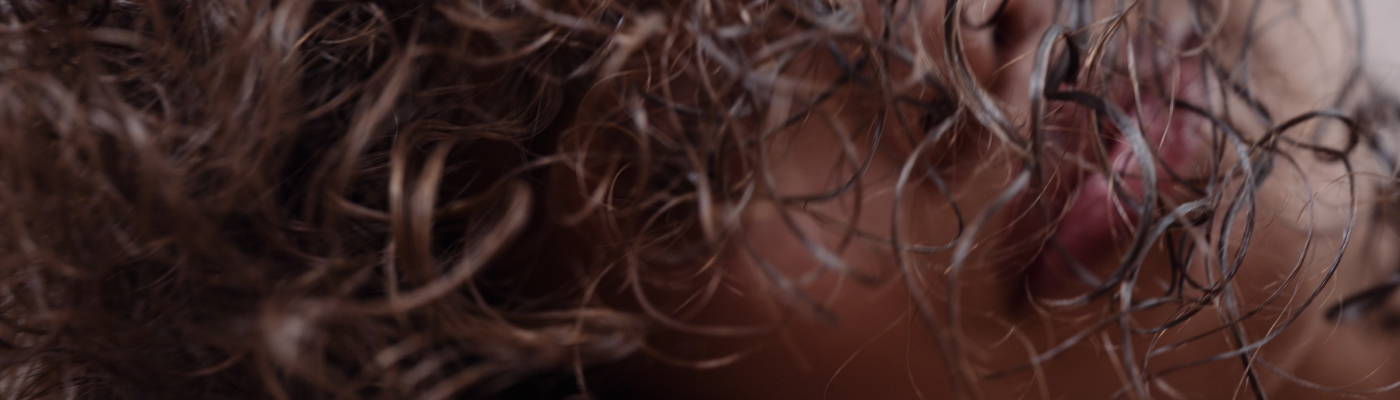 Davines The Present Time demi-permanent hair color products, hanging from a string like clothes