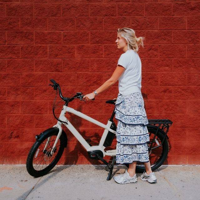 Female holing an electric cargo bike