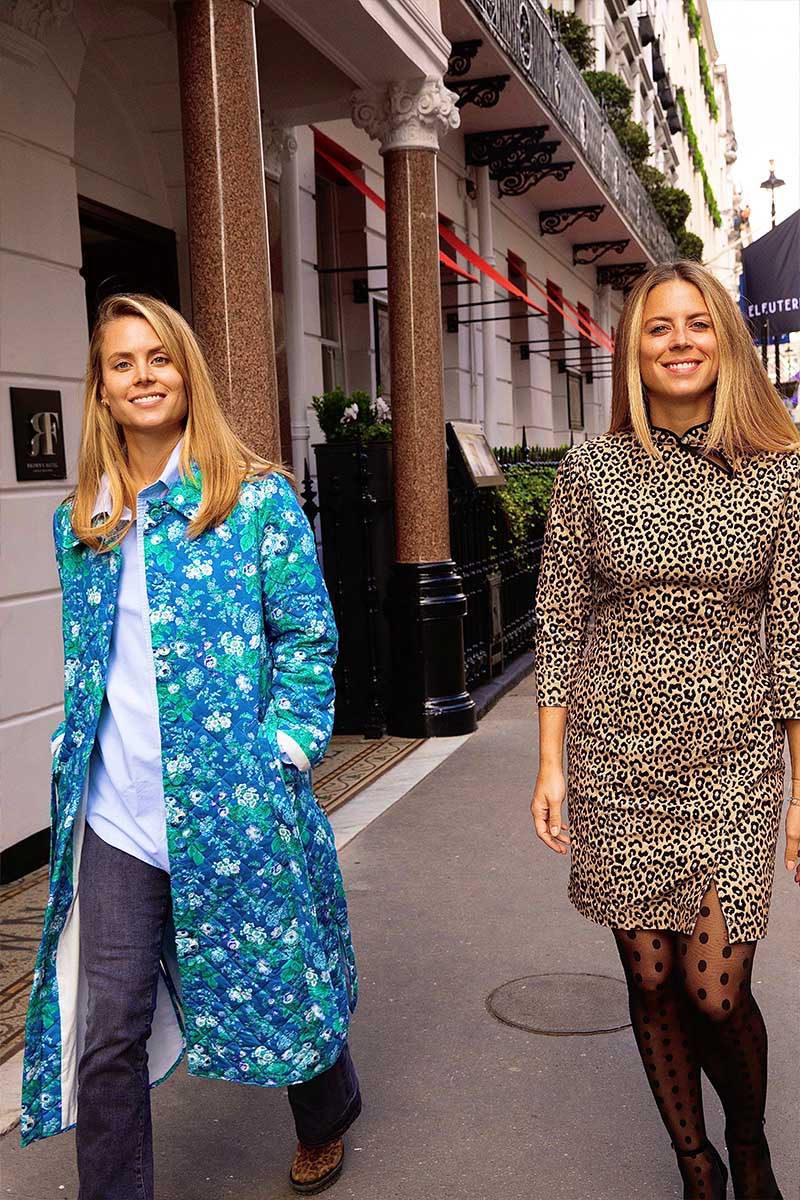 Lydia and Irene Forte wear YOLKE's Blue Roses Quilted Jacket and Mini Leopard Alexa Dress