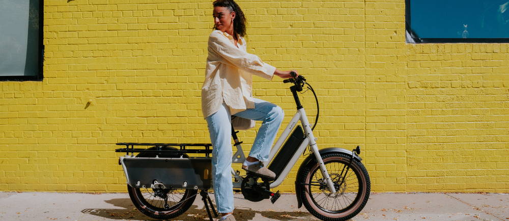 a woman riding a Specialized Globe Haul electric cargo bike