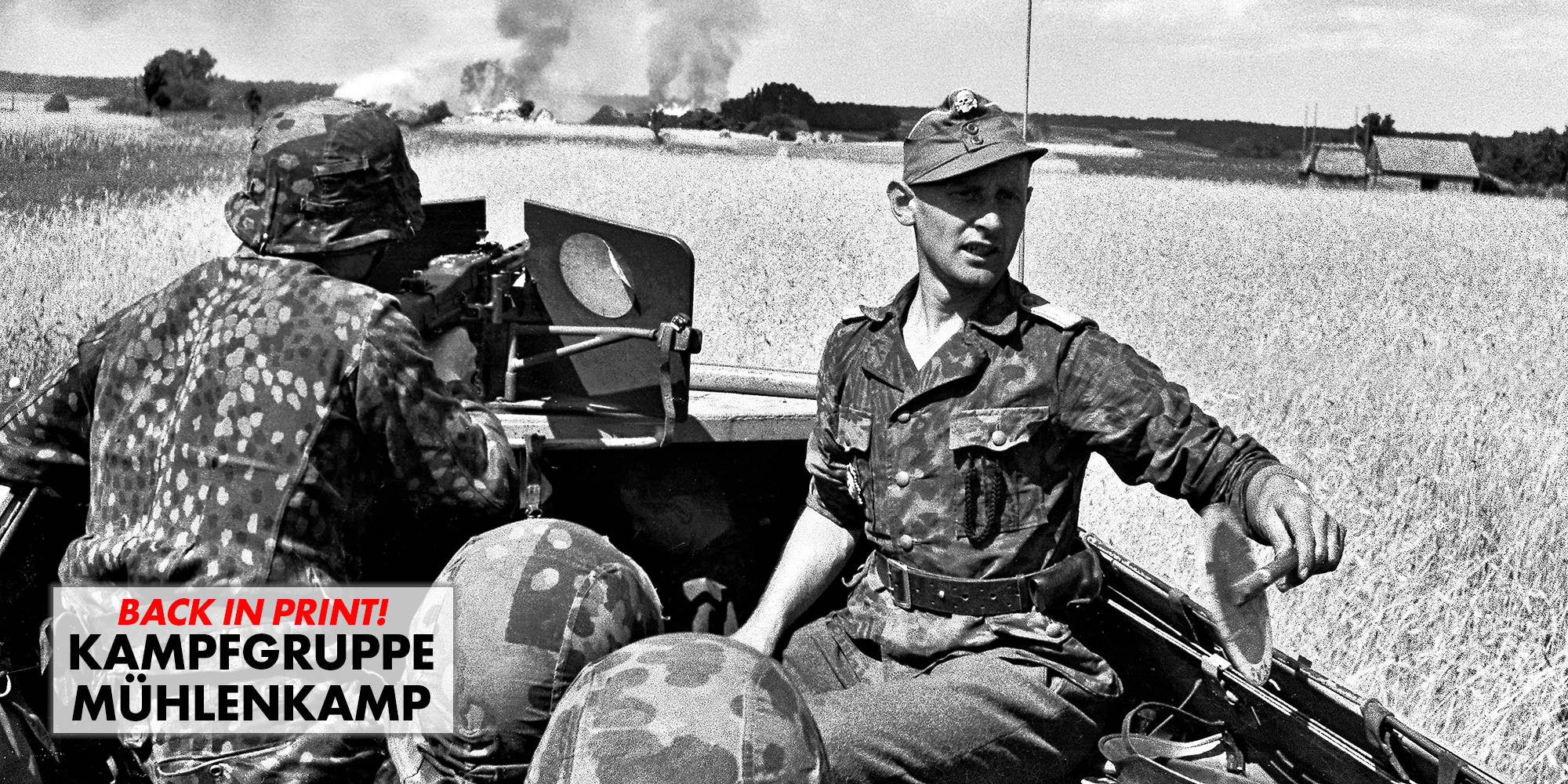 SS-Ustuf. Mahn, uses a two-sided red and white traffic control paddle while another Waffen-SS soldier fires the MG-42 machine gun.