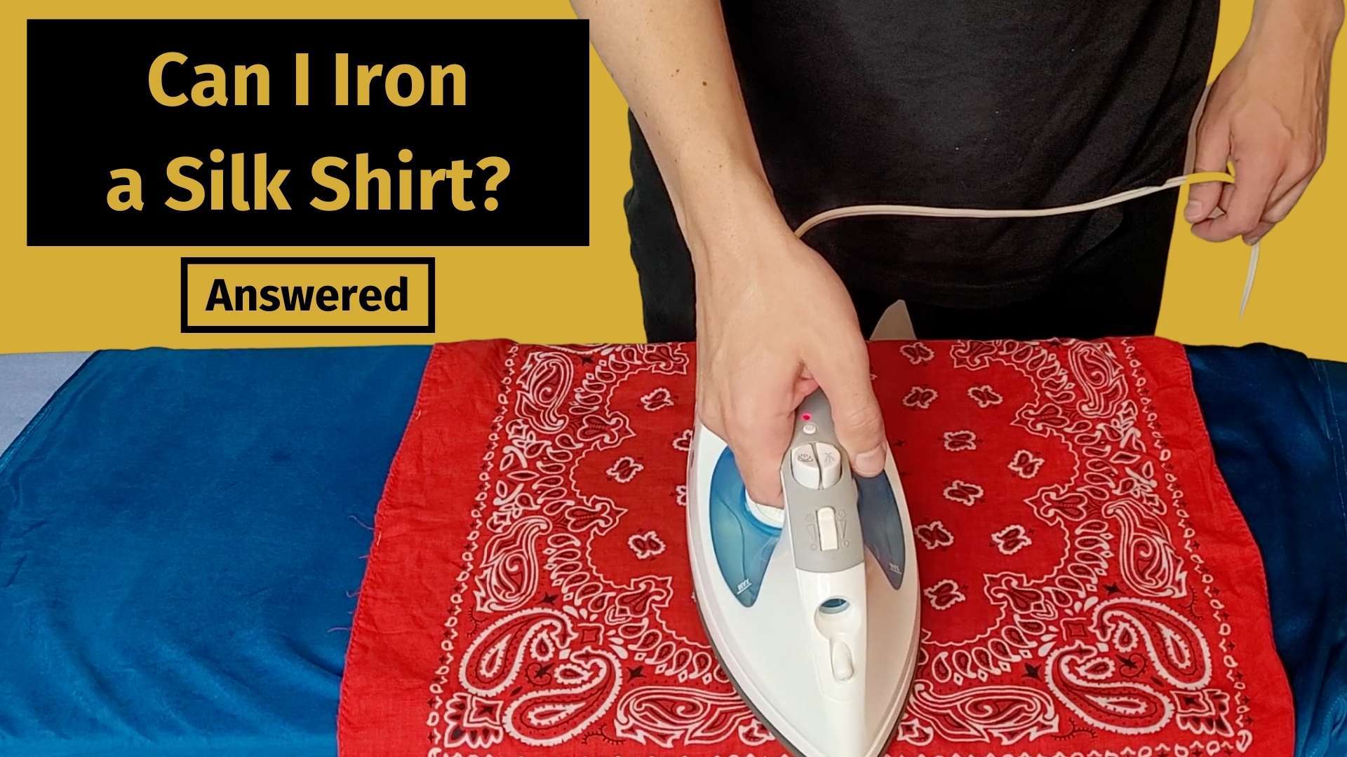 can i iron a silk shirt banner image with a man ironing a blue silk shirt on an ironing board