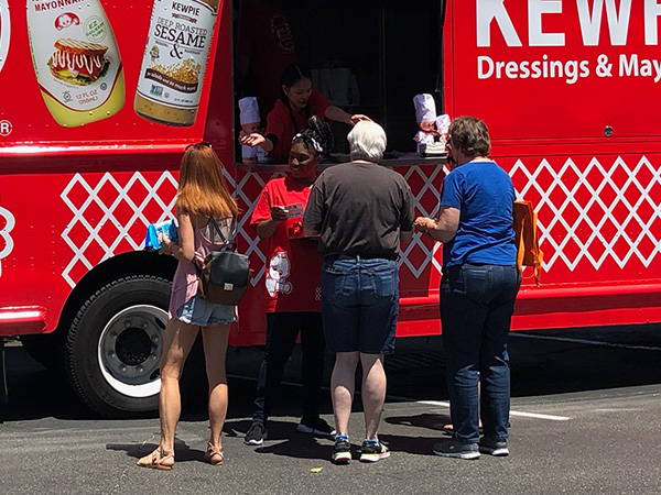 Getting food at kewpie food truck in Safeway parking lot