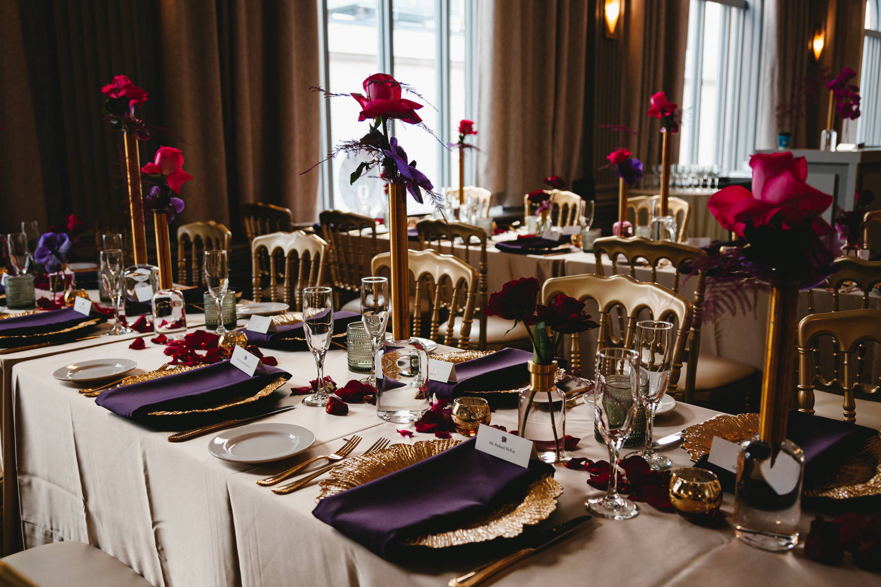 Valentines Day Wedding at Wilder Room in Rochester NY. Bud vase and brass centerpieces in reds and purples at the wilder room 