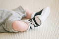 Toddler feet with shoes.