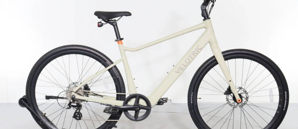 a white Velotric T1 ST Plus electric city bike