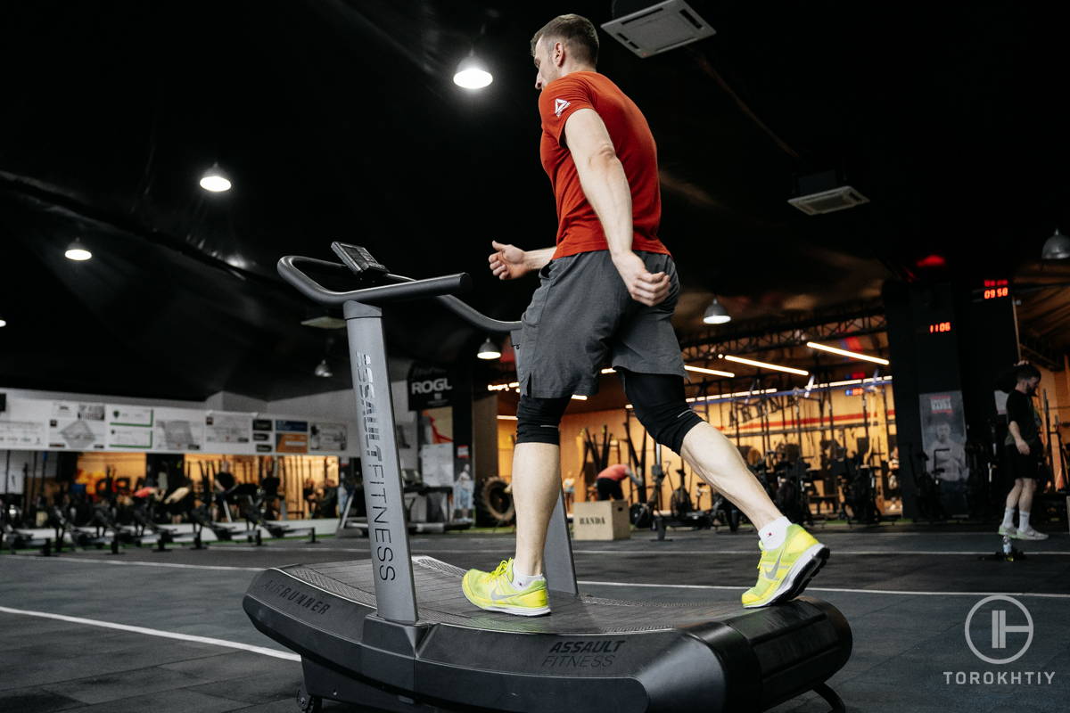 athlete training in gym on treadmill