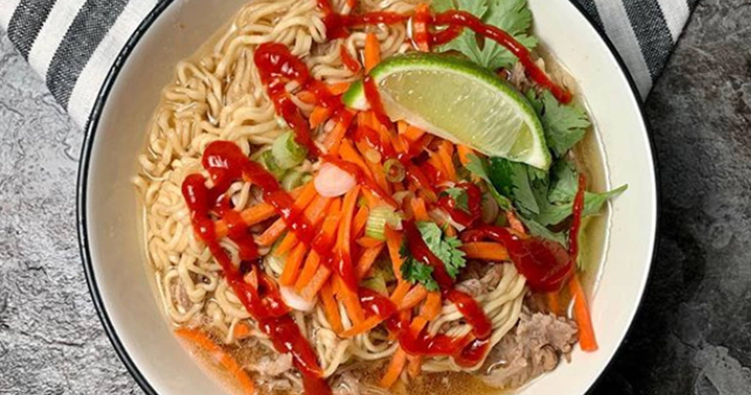A bowl of noodles with a variety of ingredients