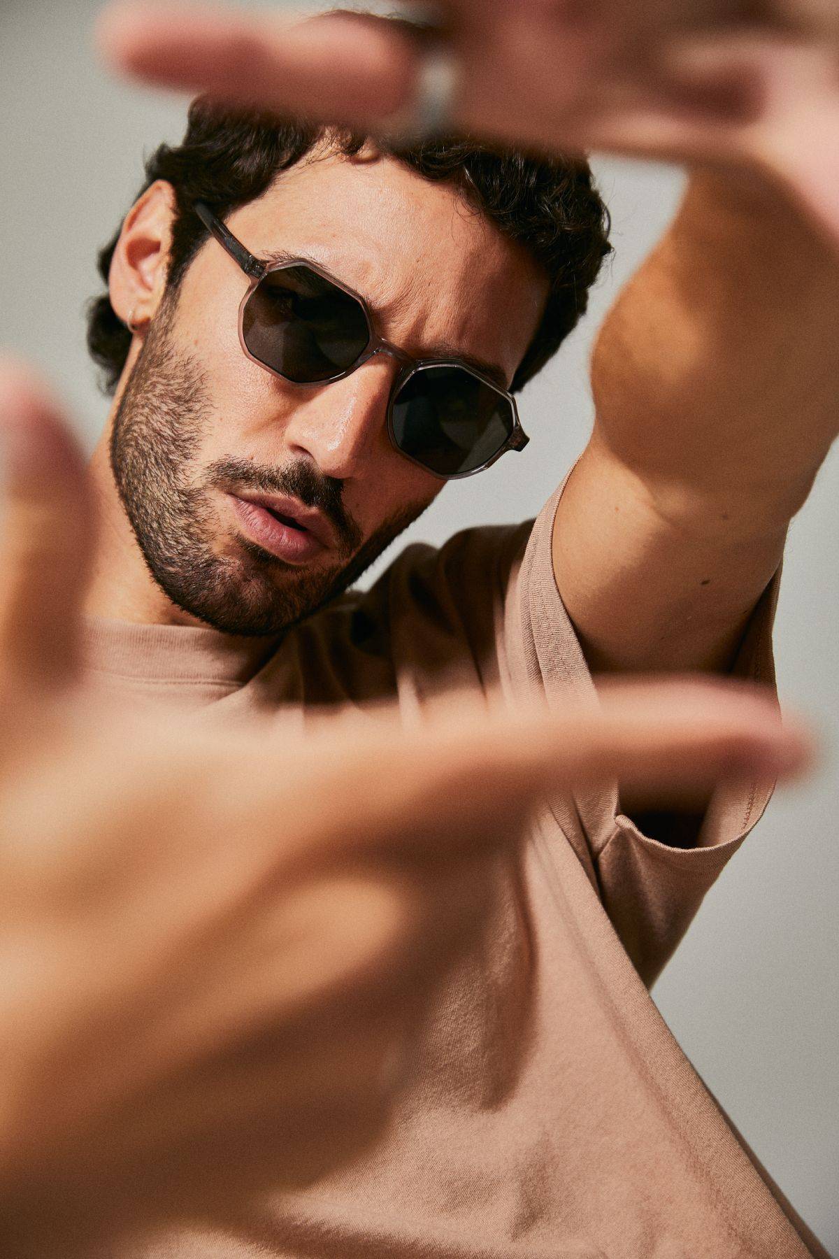 Male model wearing Ozeano polarised sunglasses